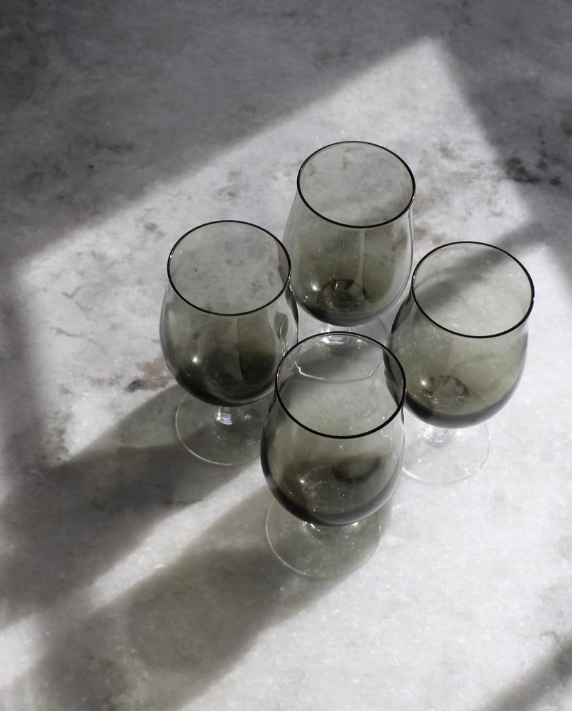 A set of four smoky grey glasses perfect for an after dinner digestif.